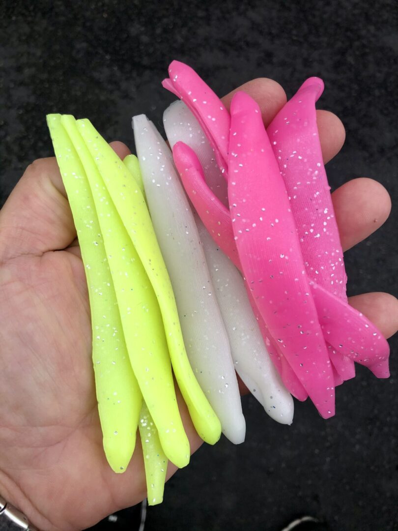 A hand holding some plastic sticks in each other