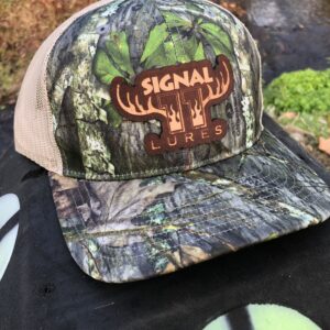 A hat that is on top of some grass.