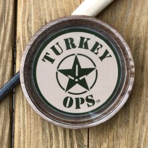 A wooden table with a turkey ops logo on it.