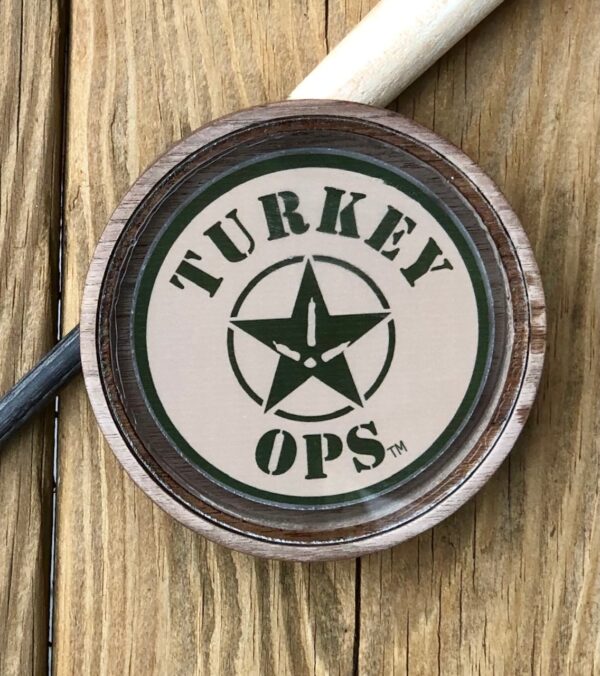 A wooden table with a turkey ops logo on it.