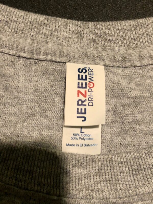 A label on the back of a sweater.